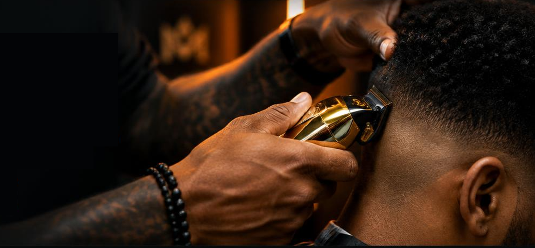 Barber creating a precise fade with professional clippers